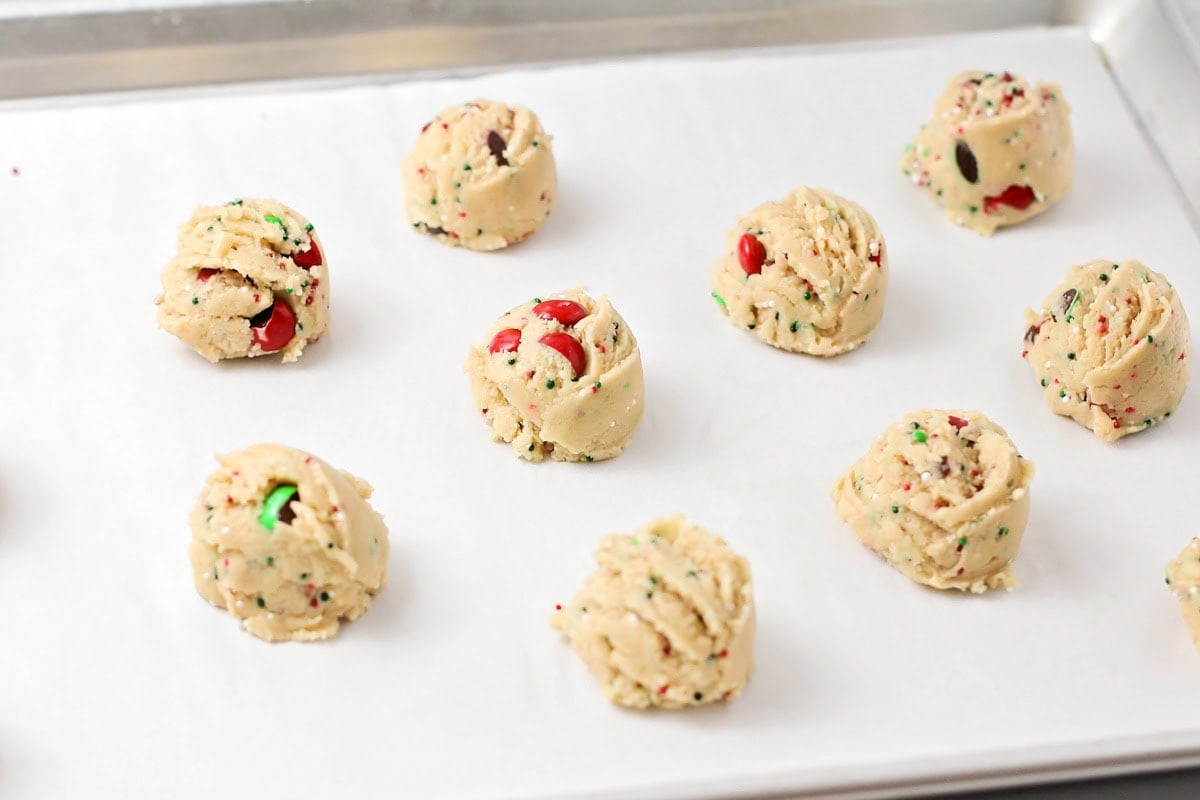 Cookies scooped on a baking sheet.