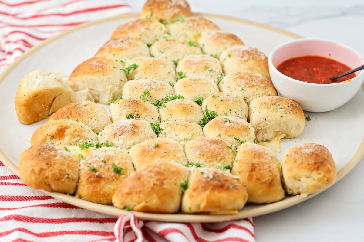 Cheesy Christmas tree pull apart bread served with marinara.