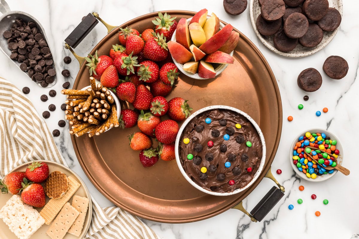 Adding strawberries to the tray.