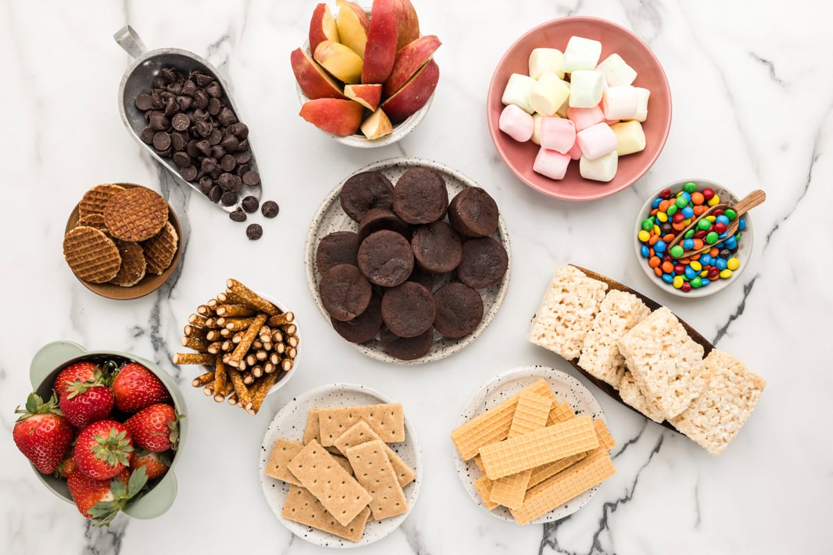 Ingredients for a dessert board on a kitchen counter.