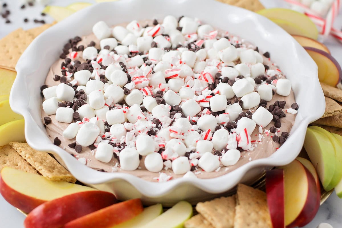 Hot chocolate dip served with graham crackers and apple slices.