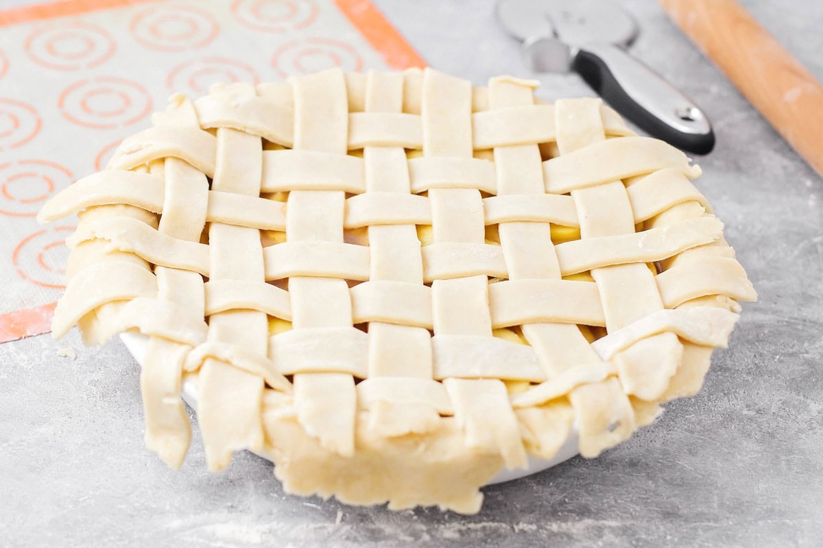 A pie with a lattice crust ready to be baked. 