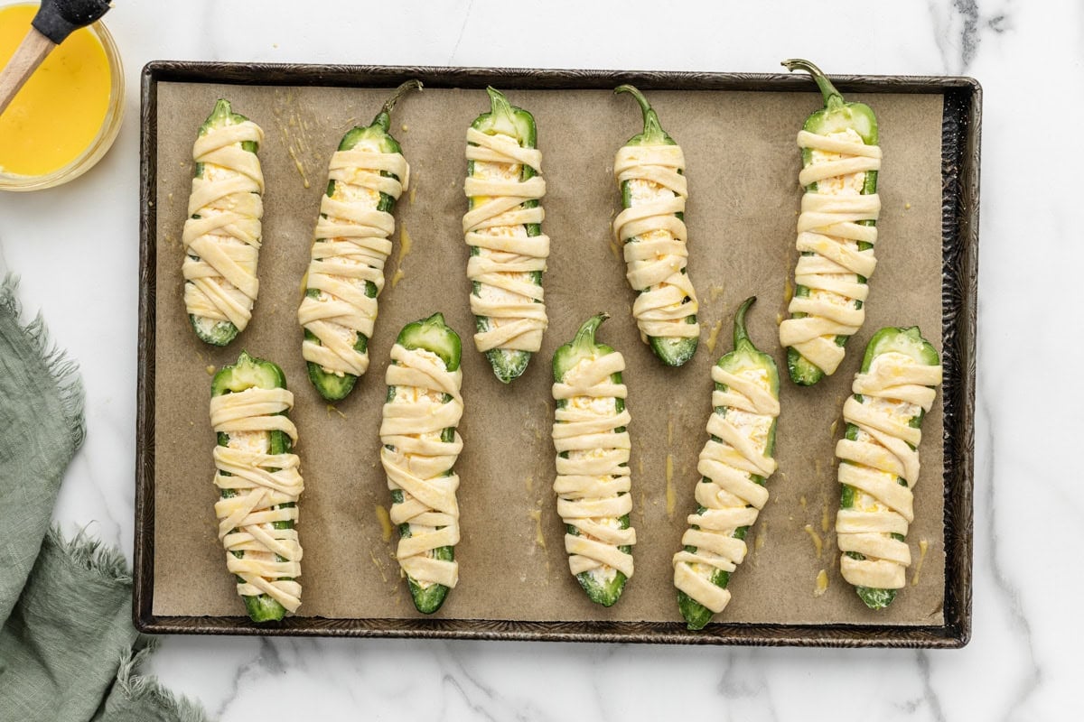 Crescent dough wrapped around Jalapeños.