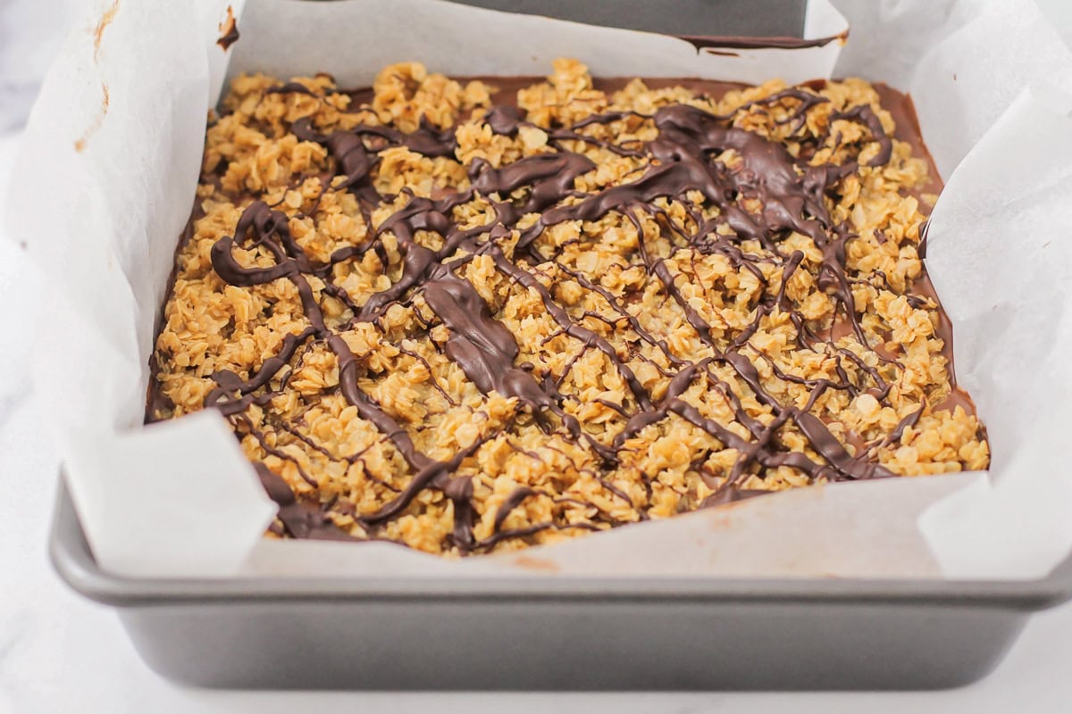 No bake chocolate oat bars set up in baking dish.