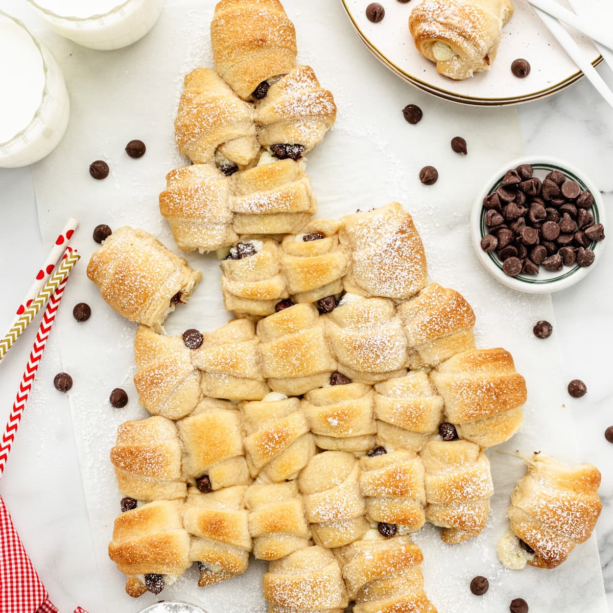 A pull apart cheesecake Christmas tree served with milk.