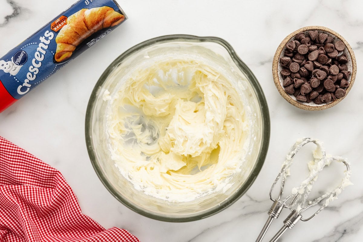 Cheesecake filling in a glass bowl.