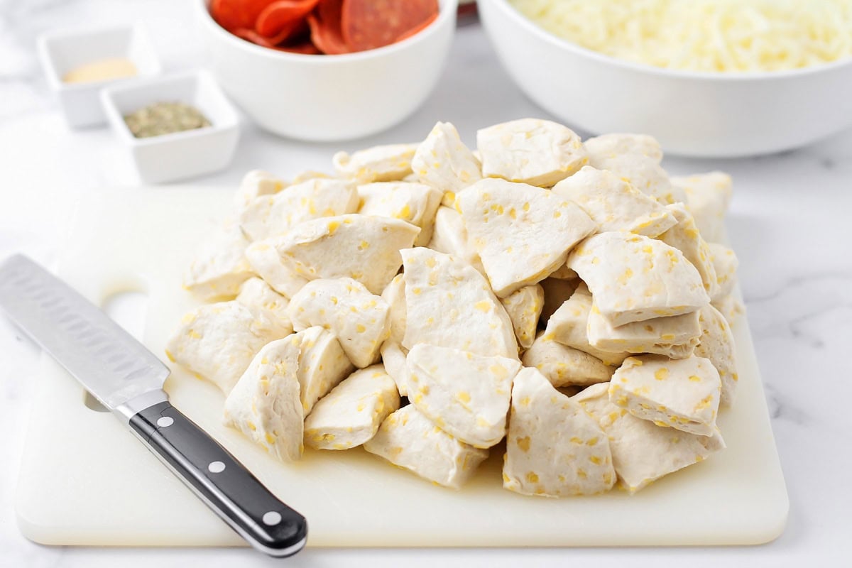 Biscuits being cut into quarters.