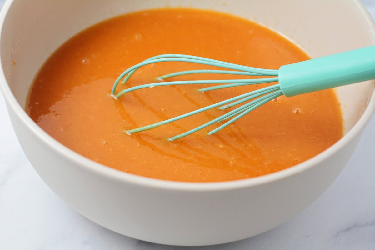 Pumpkin bundt cake batter mixed in mixing bowl.
