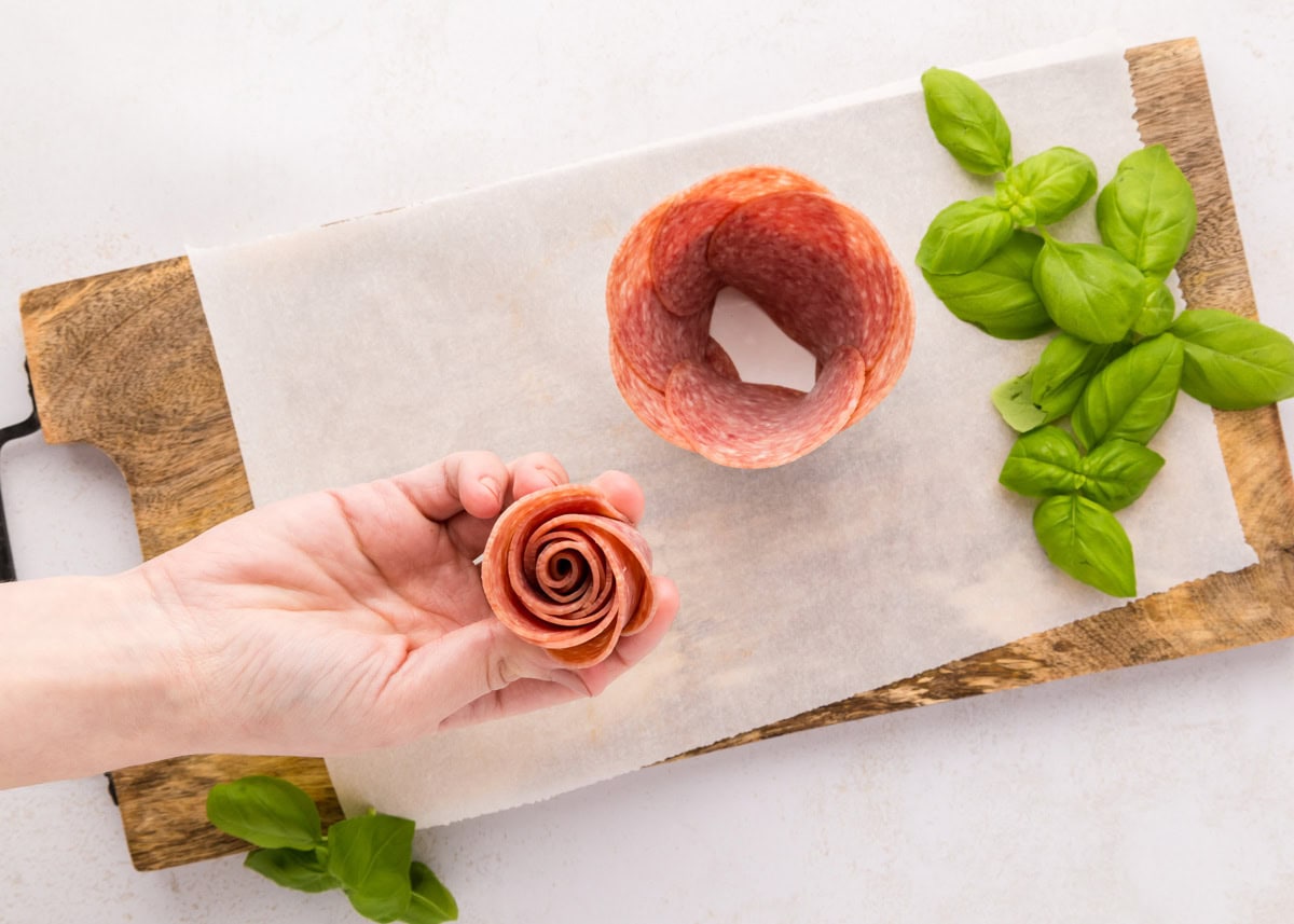 Rolled salami to place in a jar.