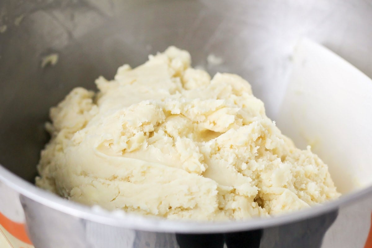 Sugar cookie dough in Kitchen-Aid mixer.