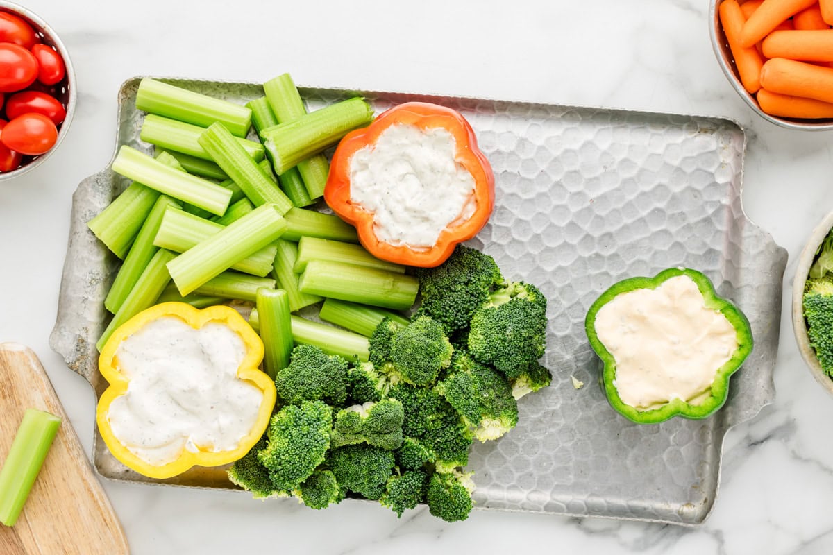 Process picture for how to make a veggie tray.