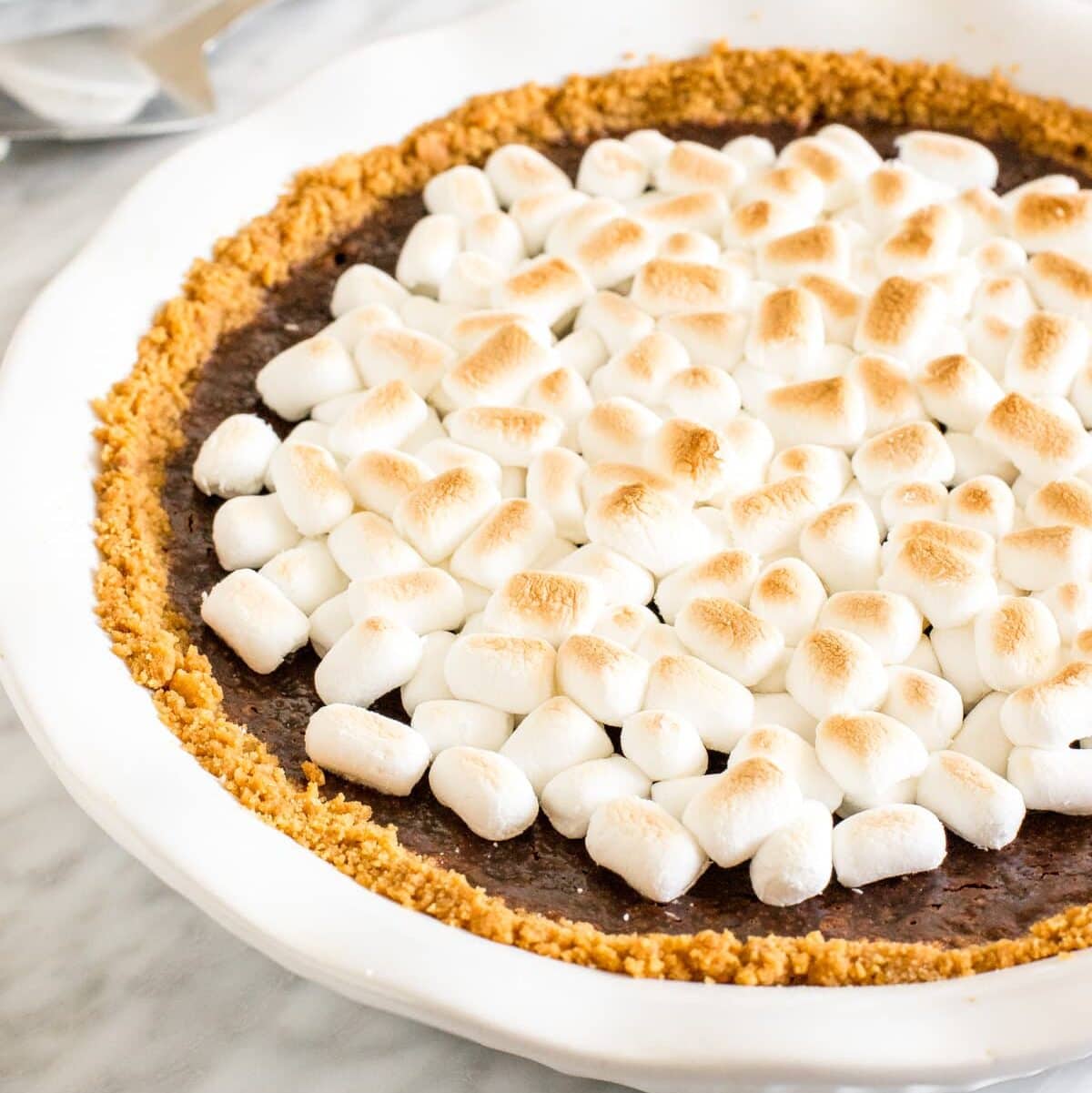 S'mores Pie with toasted marshmallows on top.