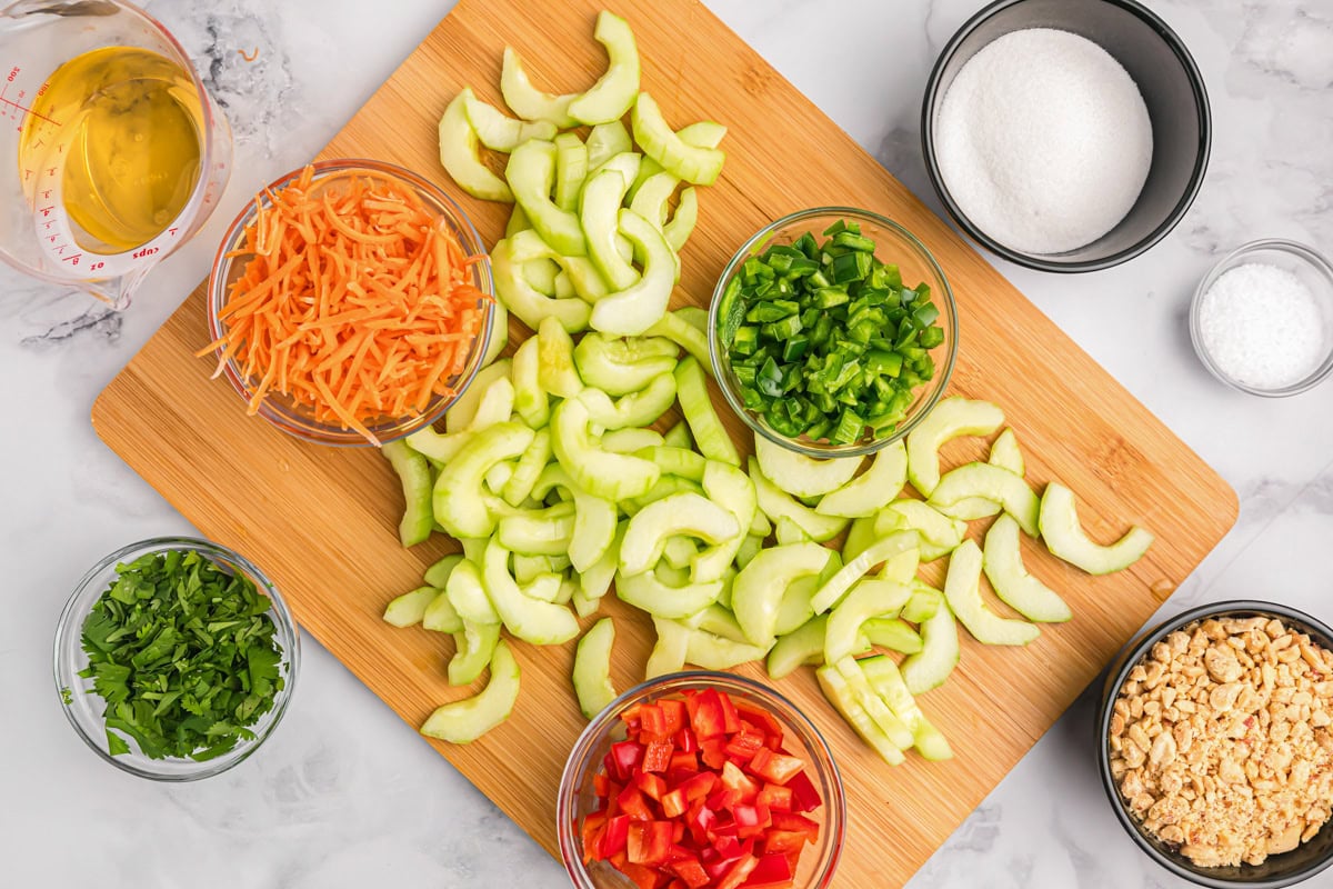 Chopped and prepped veggies on a cutting board.