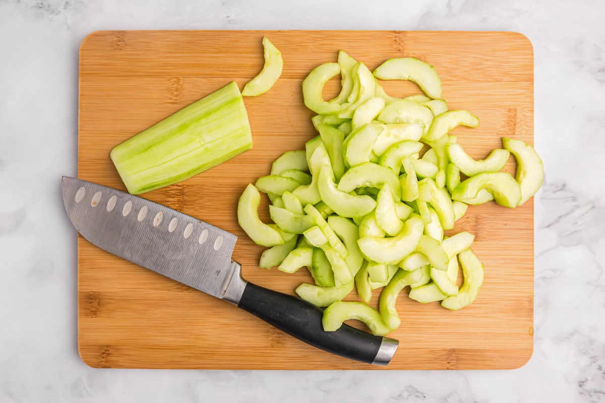 Chopped cucumbers on a cutting board.