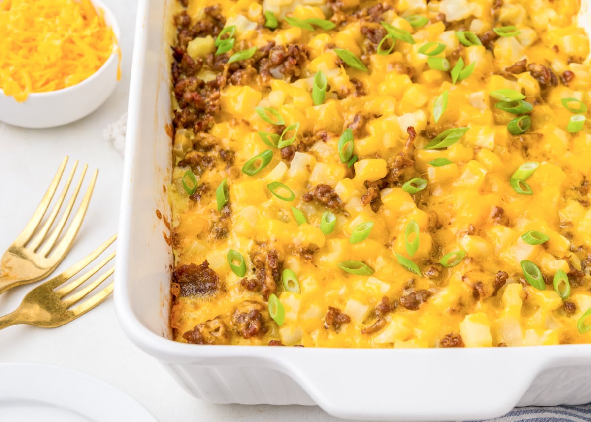 Egg and potato Casserole baked in a dish and topped with green onions.