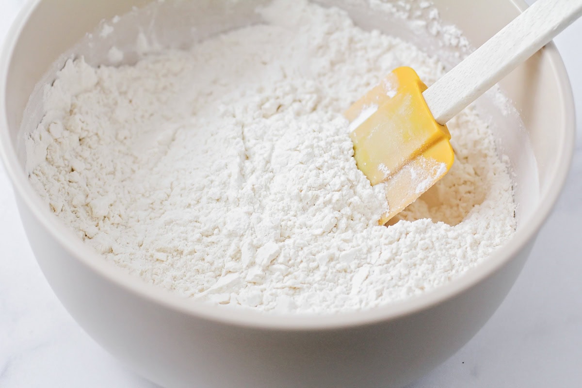 Flour, sugar, baking powder and salt in a bowl.