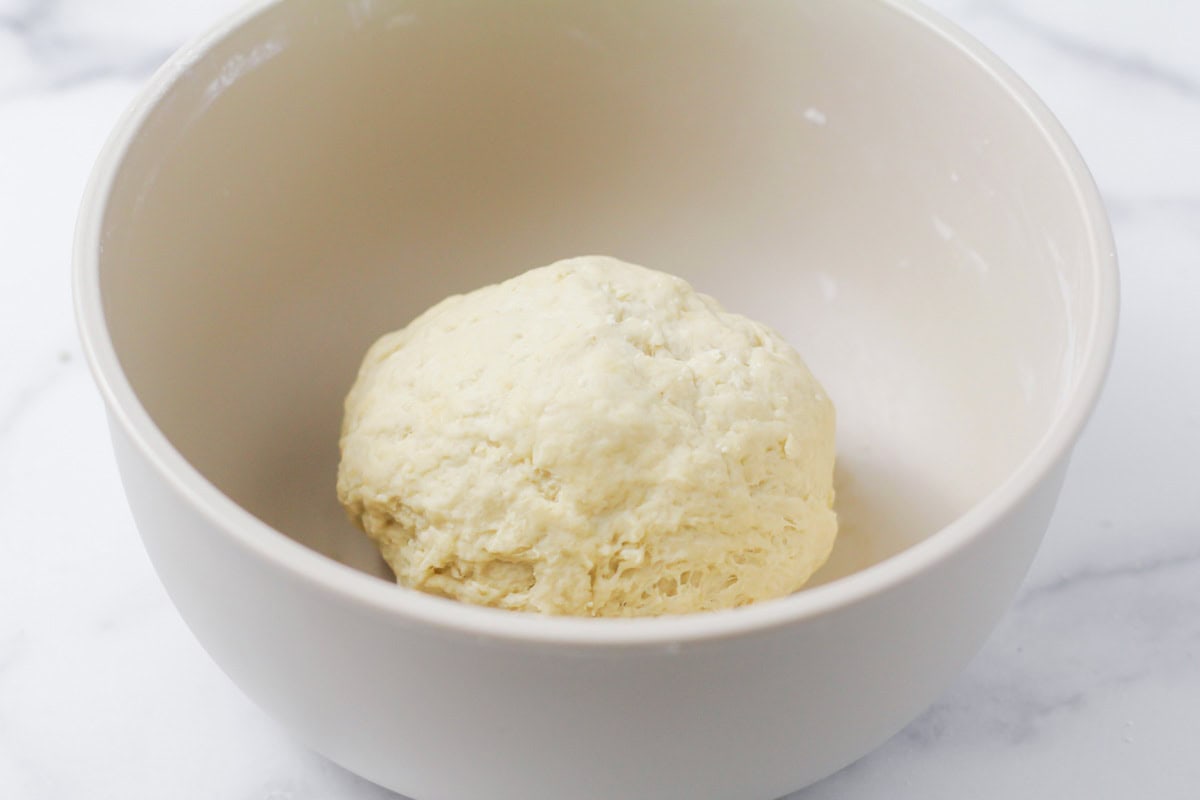 Bunuelos dough ball in bowl.