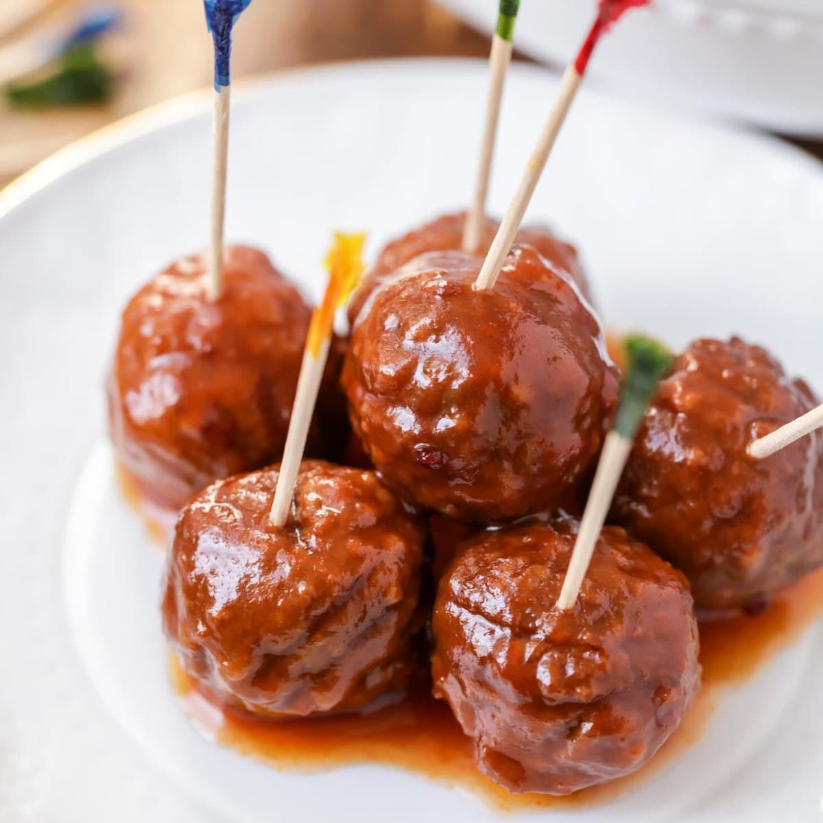 Crockpot Meatballs close up image on white dish.