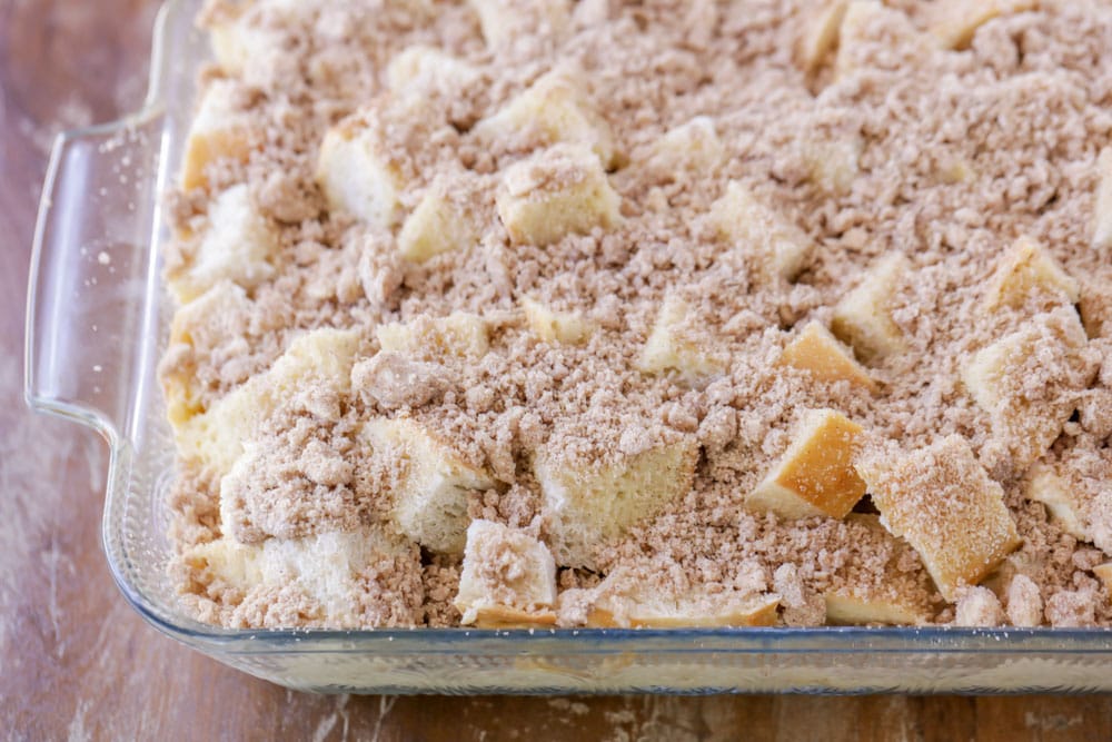 Cinnamon and brown sugar crumble sprinkled over cream cheese french toast casserole recipe.