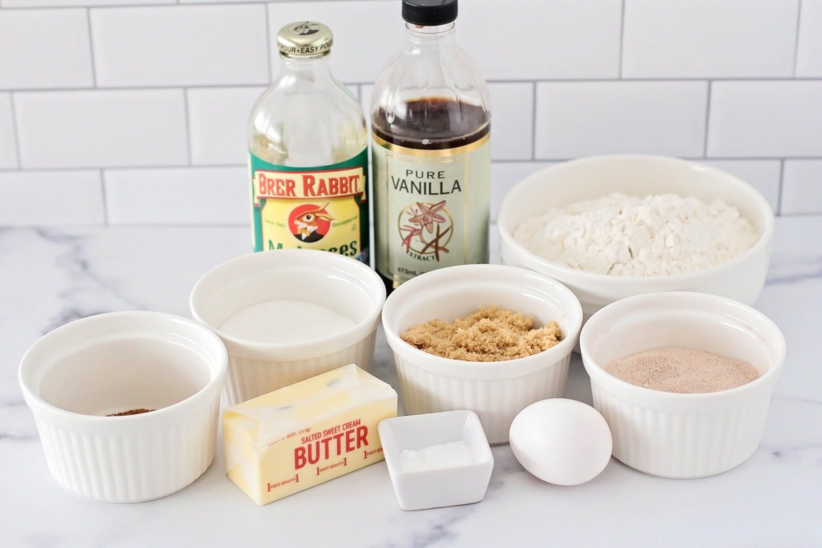 Super soft gingerdoodle cookies are perfectly spiced and coated in a cinnamon sugar mixture for two tasty cookies in one! Ingredients for gingerdoodle cookies on a kitchen counter.