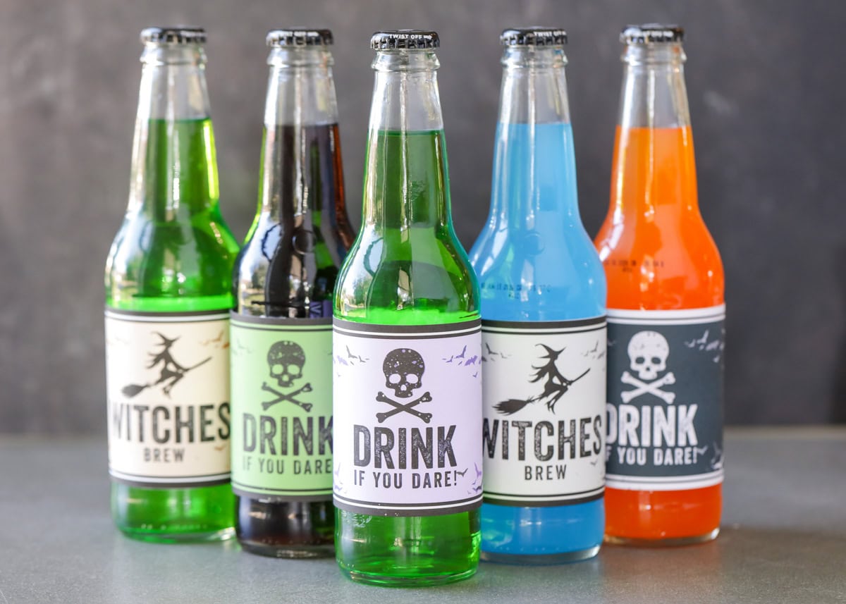 5 bottles of soda pop with Halloween labels.