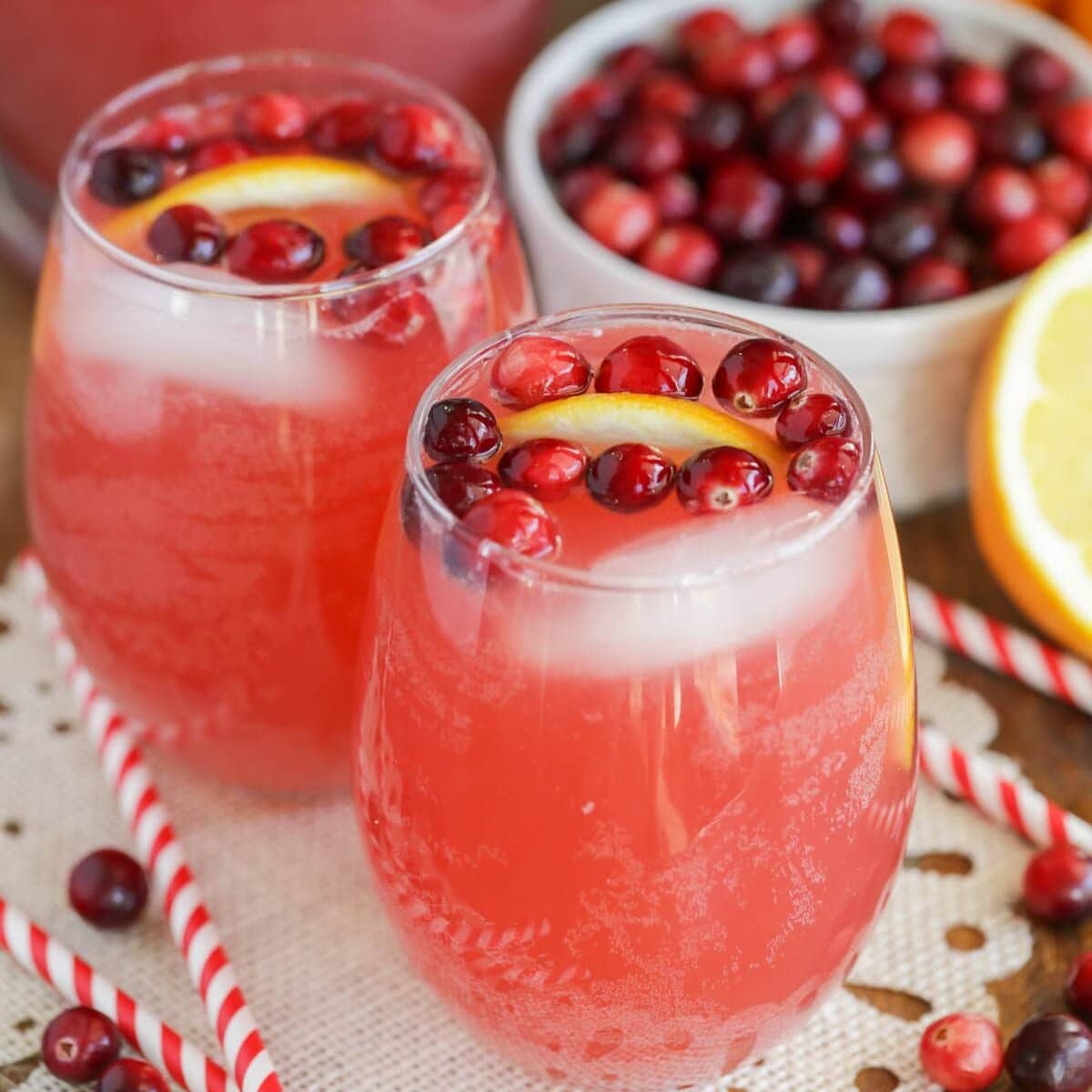 Close up image of non alcoholic holiday punch recipe with cranberries in it.