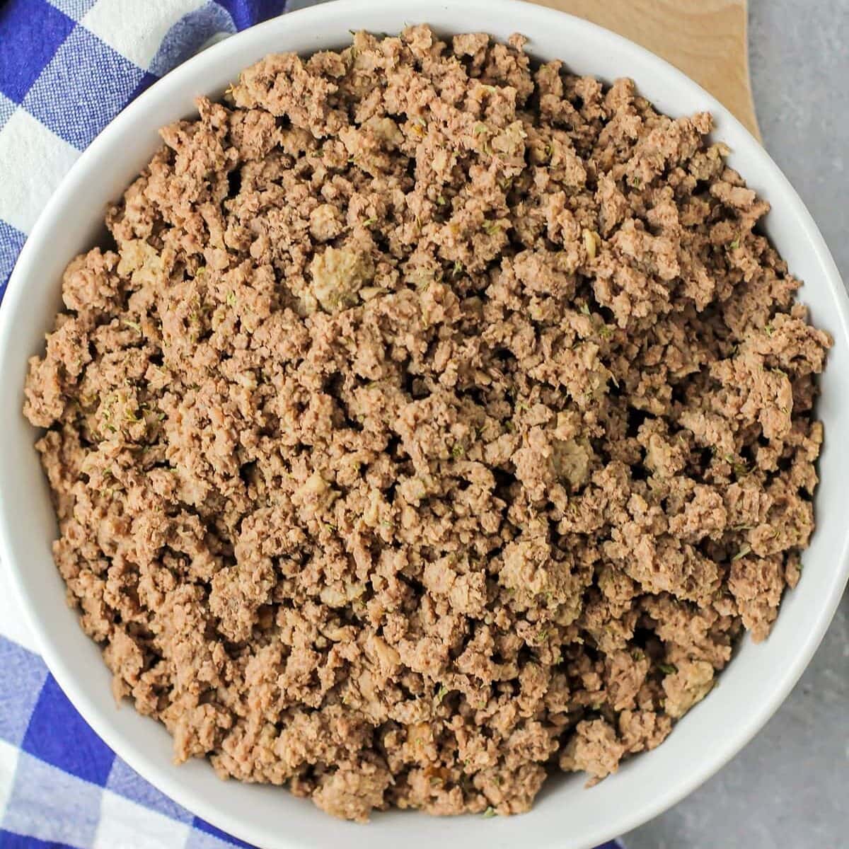 Top view of instant pot ground beef in a white bowl.