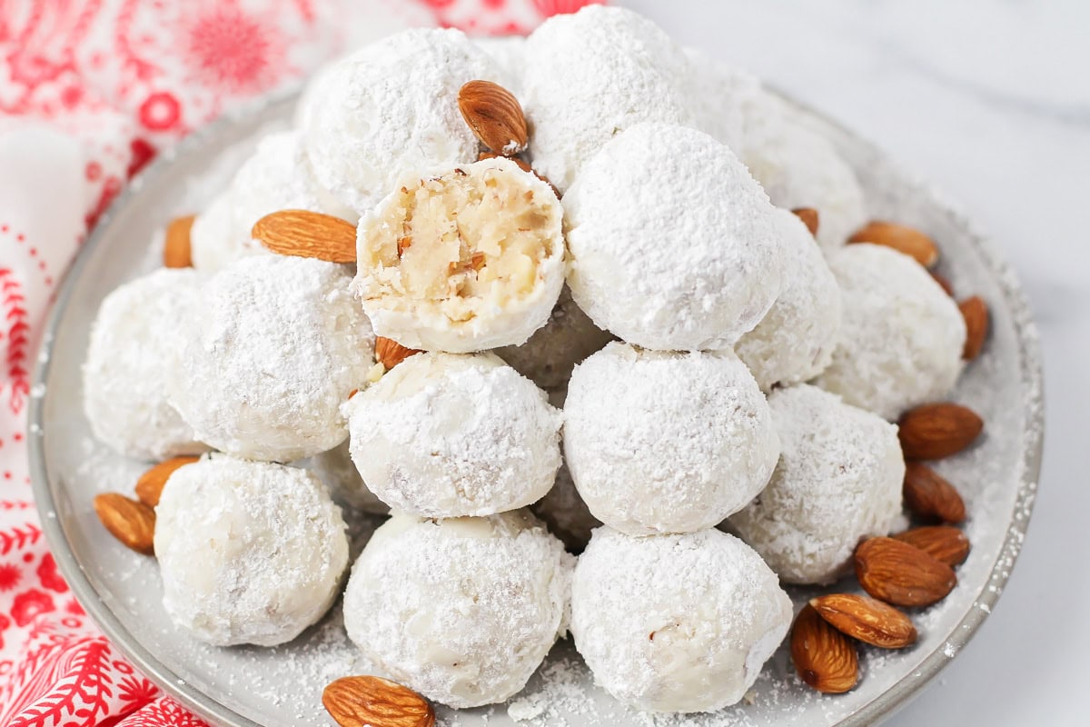 Mexican wedding cookies piled on a plate.