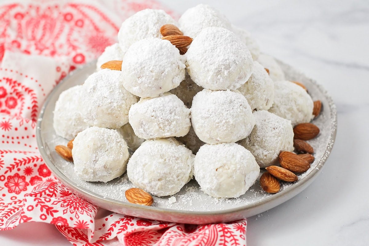 Mexican wedding cookies piled on a plate.