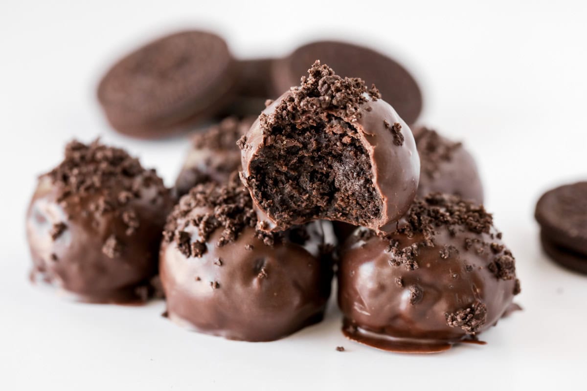 Chocolate Oreo Truffle Balls stacked on top of each other.