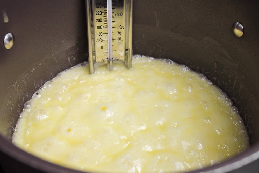 Melting butter and brown sugar together for homemade pretzel toffee.