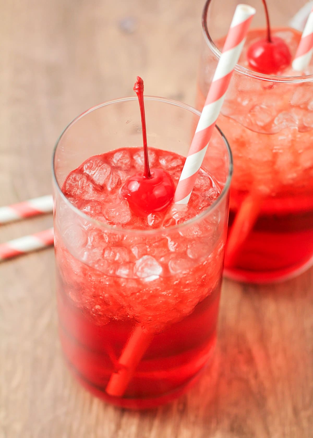 A Shirley Temple topped with maraschino cherries.