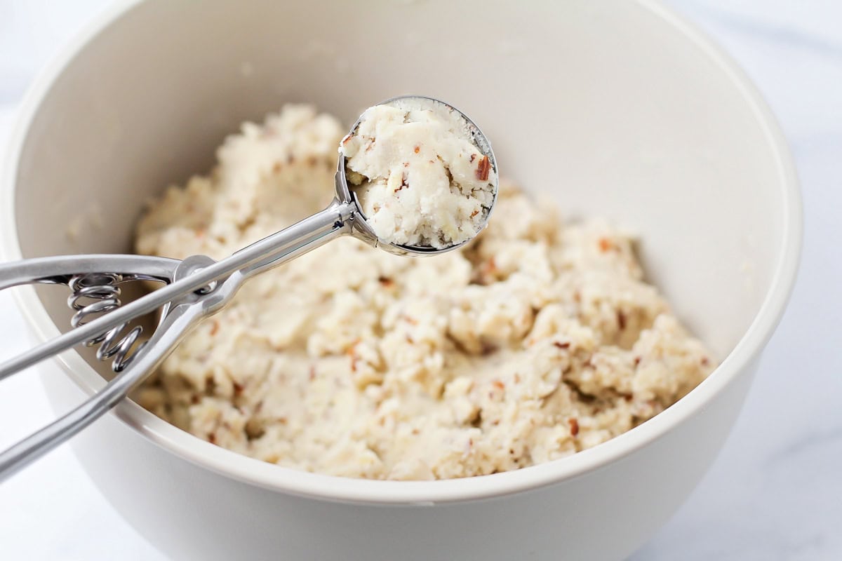 Snowball cookie dough batter in bowl.