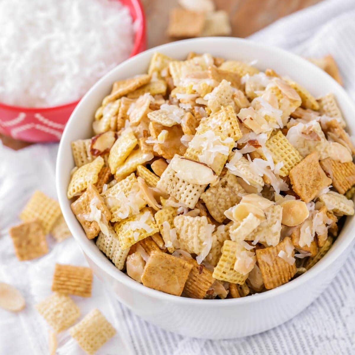 A bowl of sweet chex mix recipe on a kitchen table.