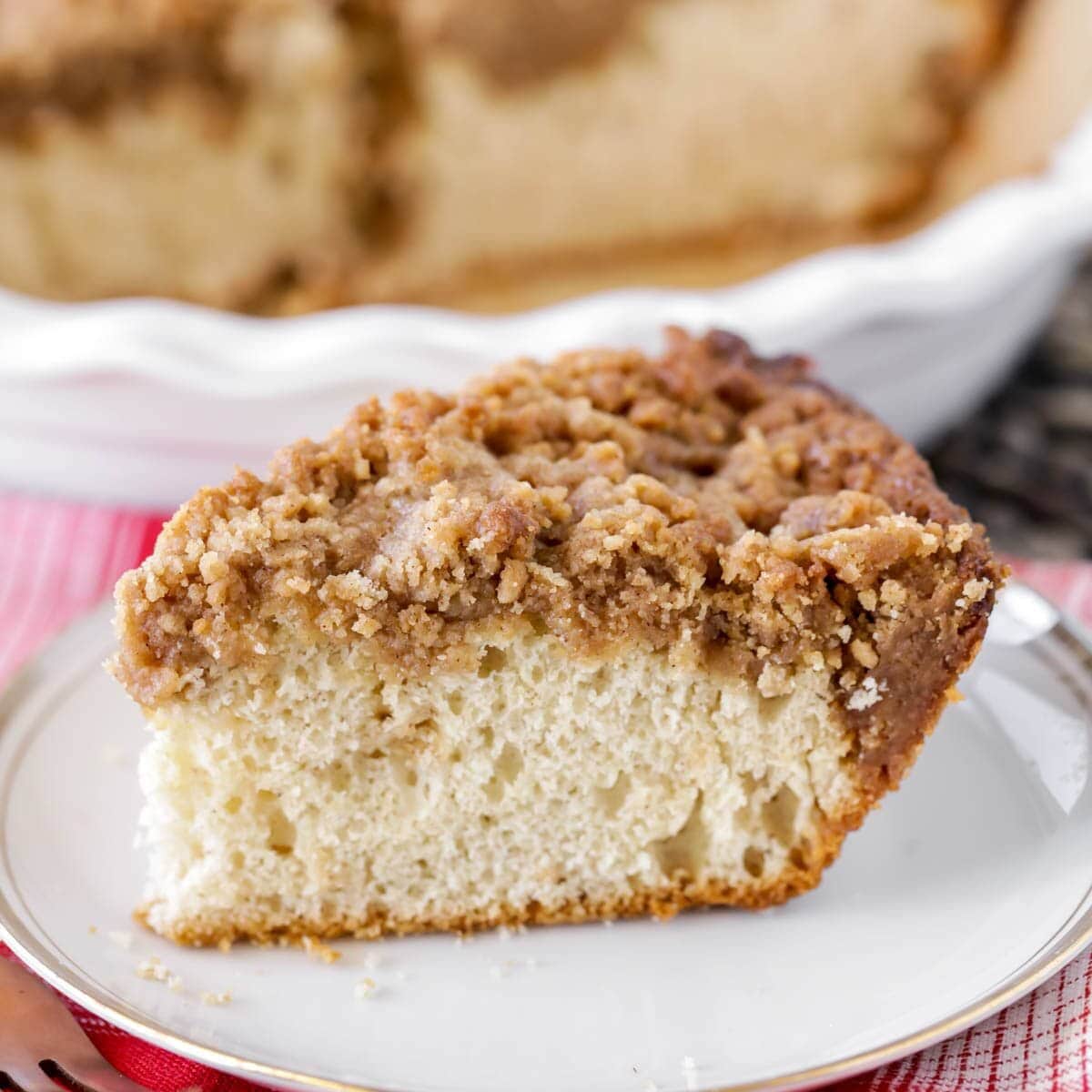 Slice of Bisquick coffee cake on white plate.