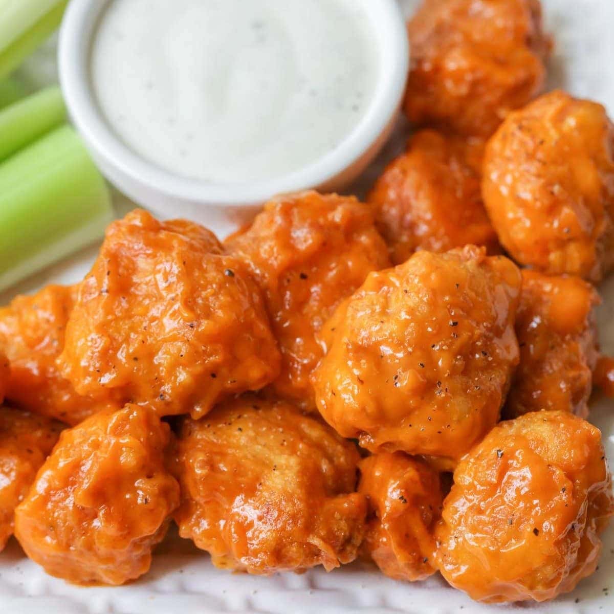 Boneless buffalo wings recipe close up image with ranch dressing.