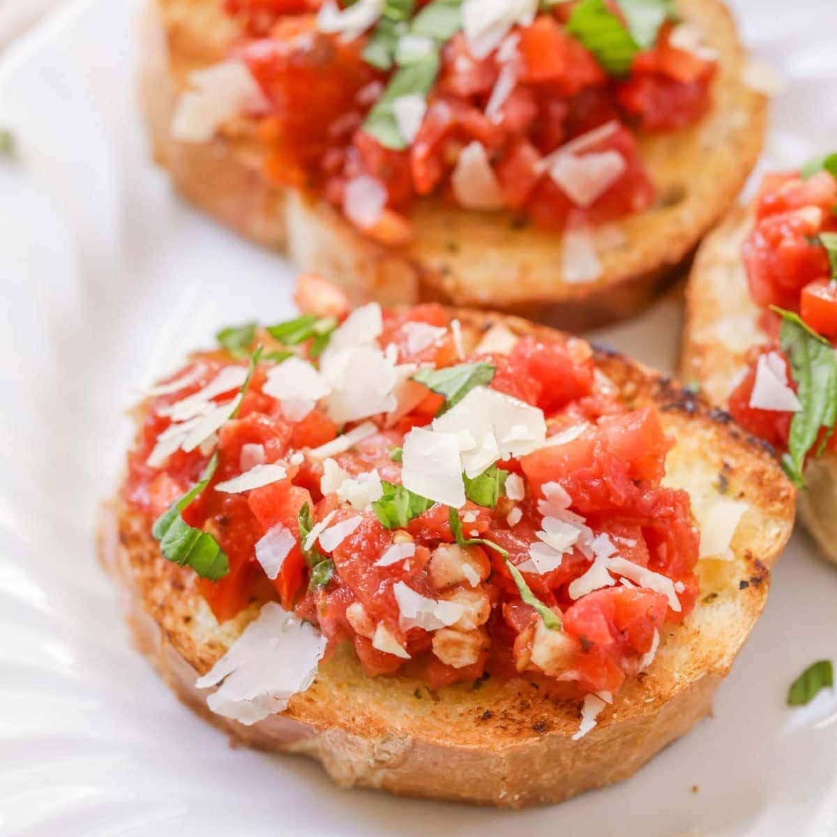 Close up image of easy bruschetta recipe on a white plate.