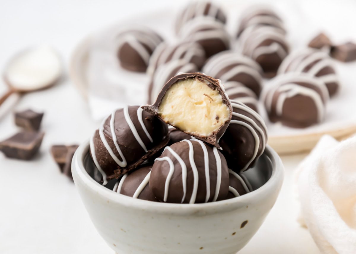 Cheesecake bites stacked on top of each other in bowl.