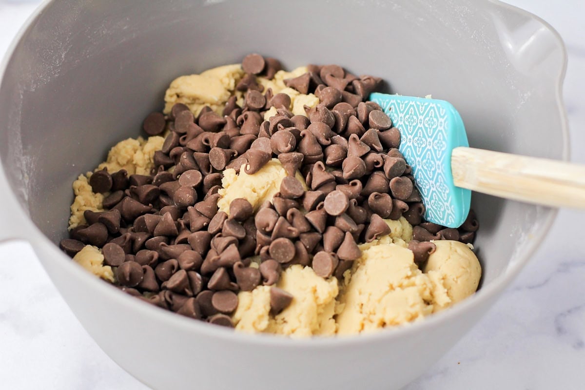 Cookie dough in gray mixing bowl.