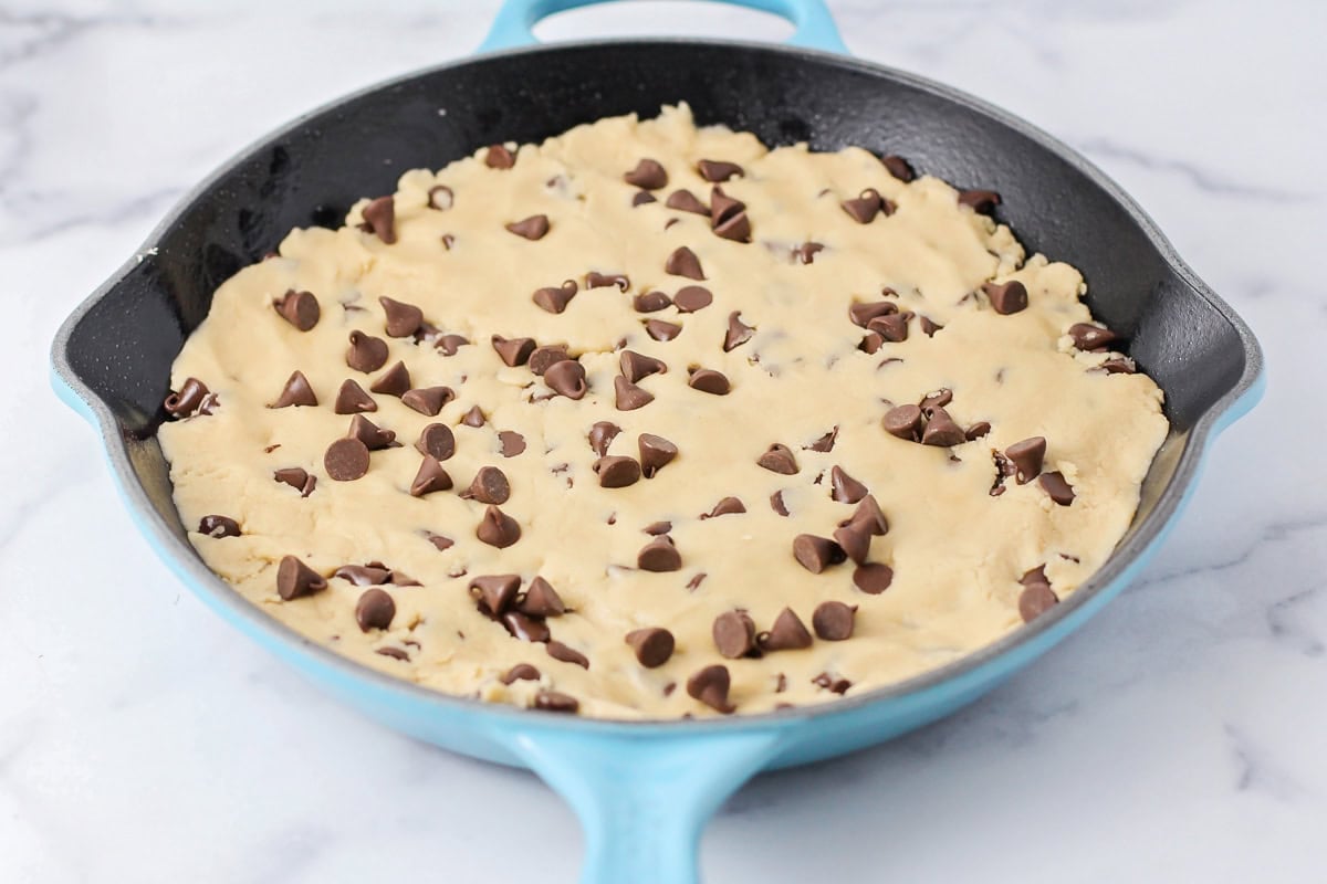 Pizookie cookie dough pressed into skillet.