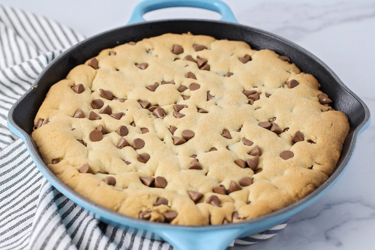 Baked pizookie cookie recipe in skillet.