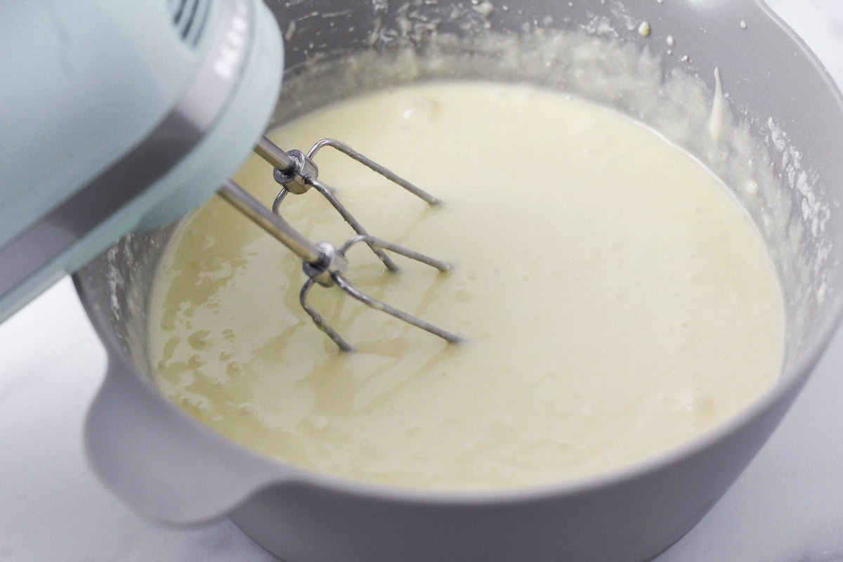 Snowman cake batter being mixed in bowl.