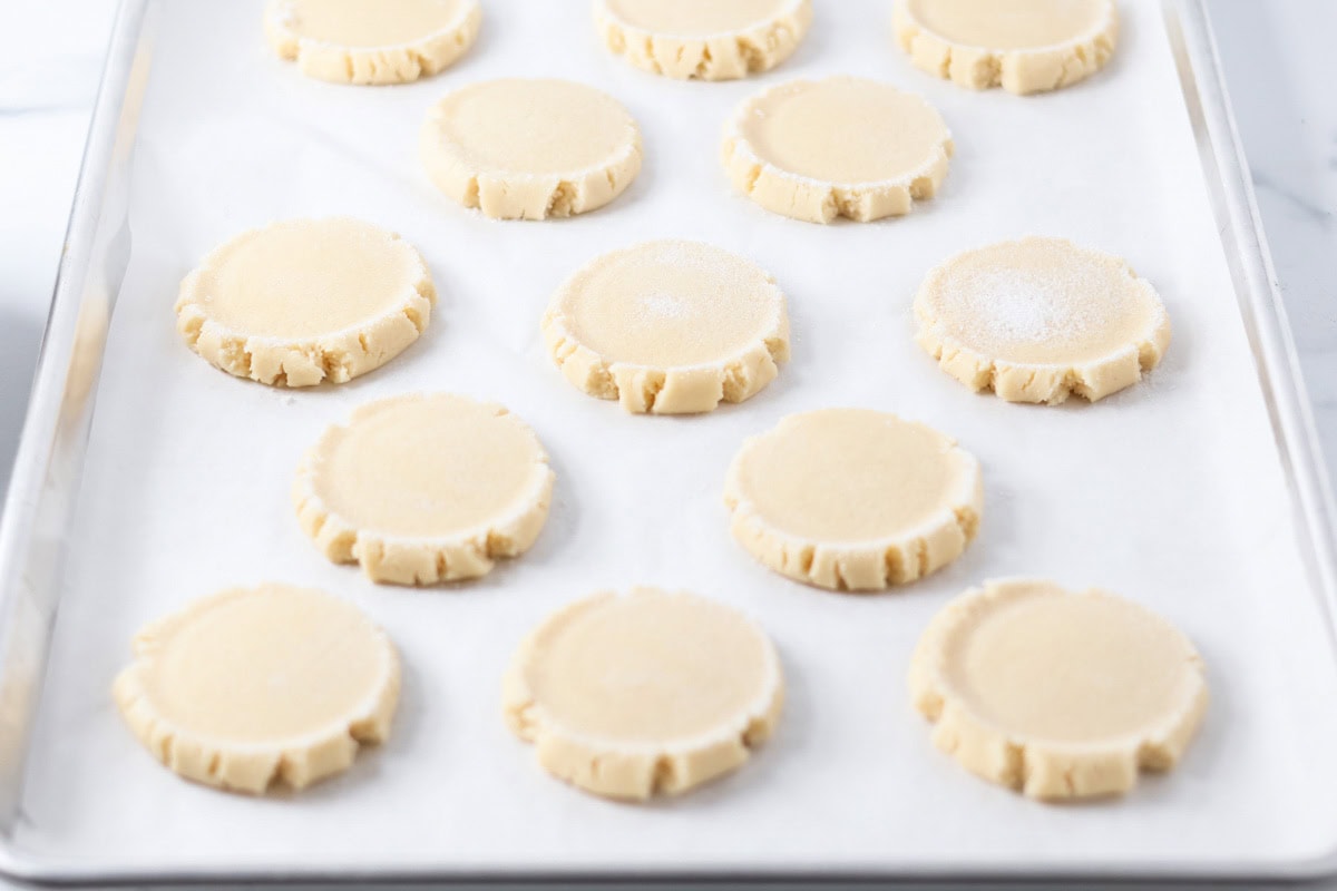 Swig cookie dough on parchment paper lined cookie sheet.