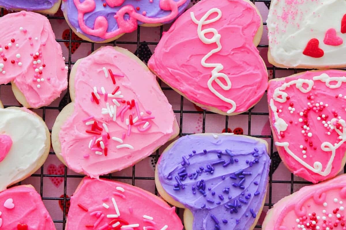 Heart shaped valentine's day sugar cookies with red and pink frosting.