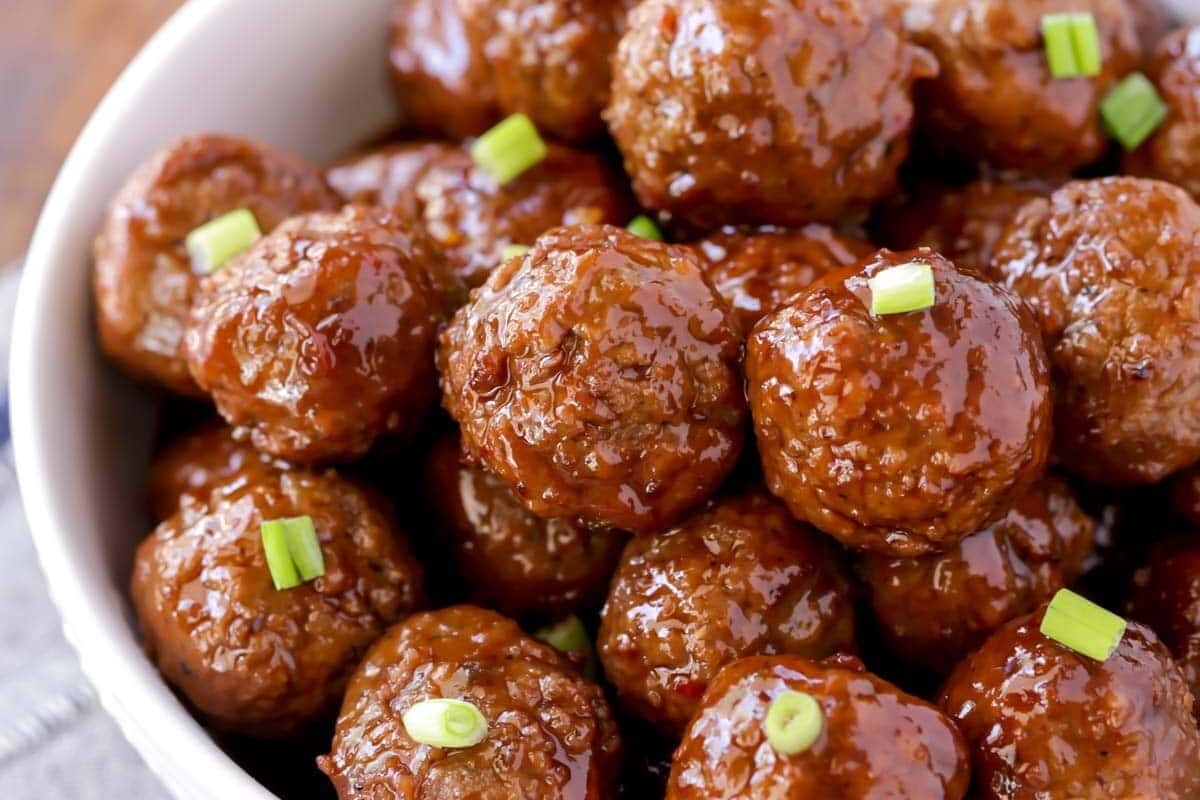 Crockpot BBQ meatballs recipe served up in a white bowl.