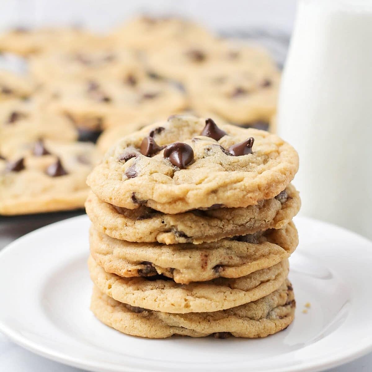 A stack of best chocolate chip cookie recipe on a white plate.