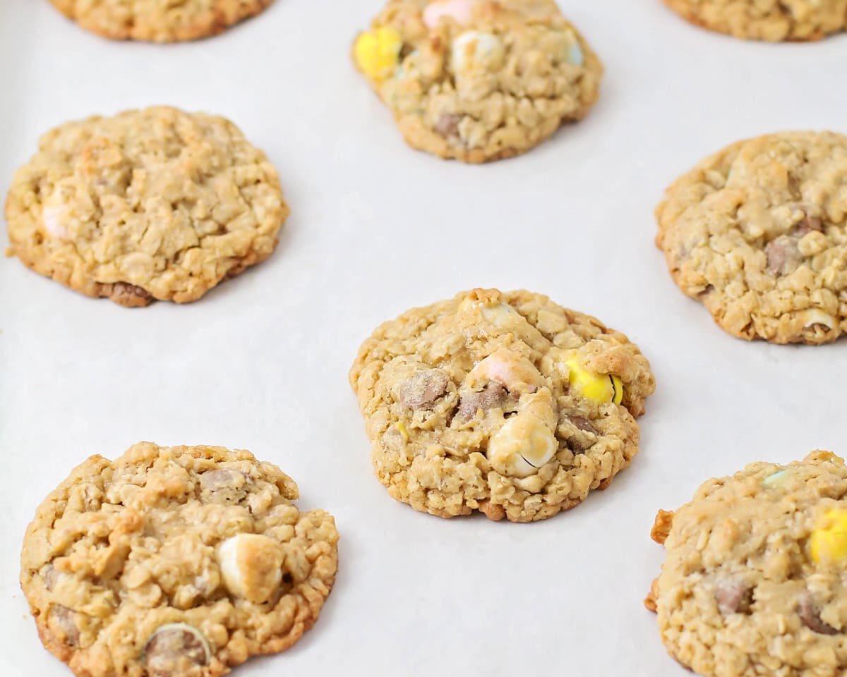 Baked cookies on a lined baking sheet.