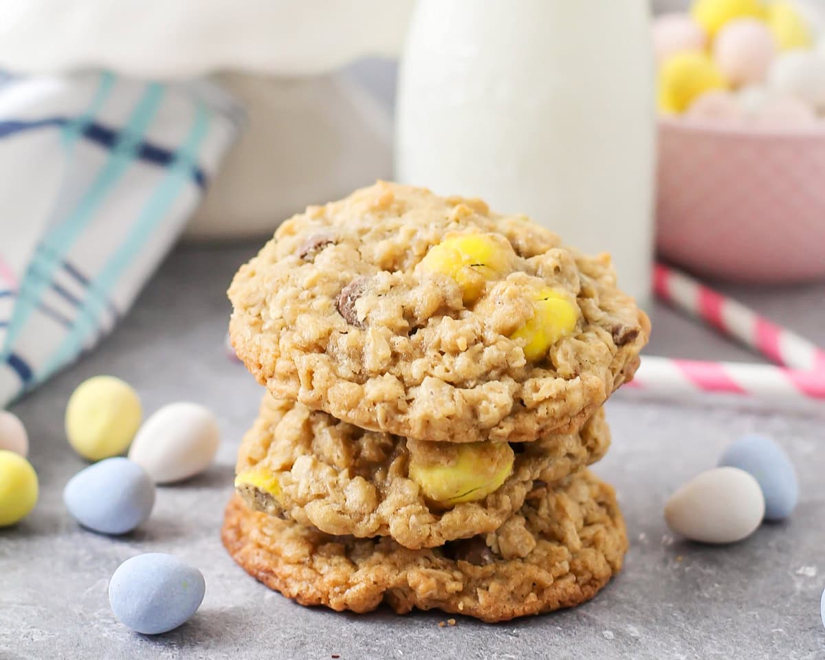 A stack of cadbury egg cookies on a kitchen counter.