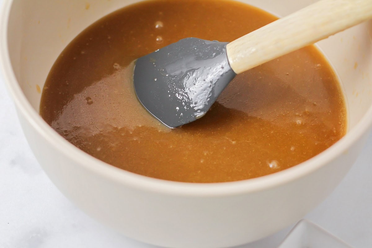 Melting ingredients for caramel popcorn in a mixing bowl.