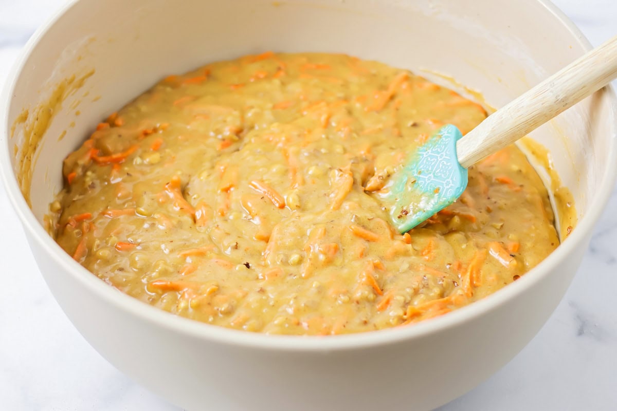 Stirring cake batter in a bowl.